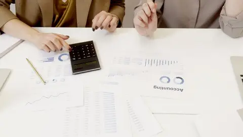 Auditors reviewing financial documents in an office meeting