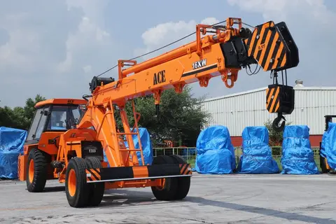 A used machinery sale or auction scene in India, showing equipment being assessed by buyers.