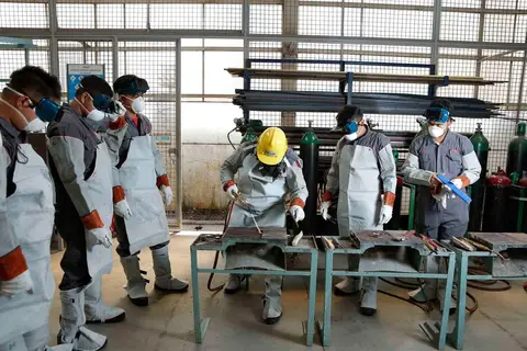 Workers attending a safety training session inside an Indian factory.
