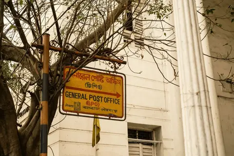 A customer at an India Post counter sending a parcel