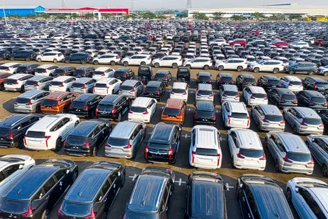 Workers on a car assembly line at an Indian automobile manufacturing plant