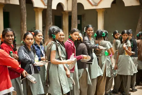 Children eating mid-day meals at a government school in India