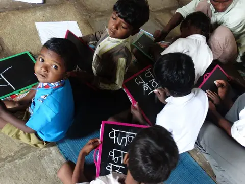 Children in a rural Indian village school, representing the low literacy levels inherited from the colonial era