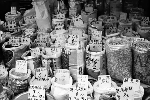 Kirana store with large sacks of rice in different varieties