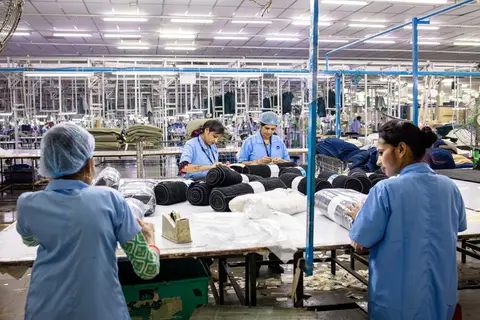 Workers on a manufacturing floor inside an Indian factory