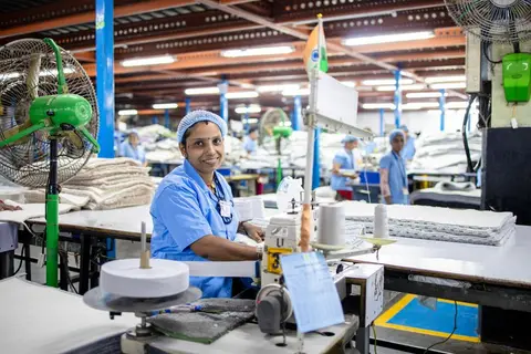 Workers in an Indian garment factory on the production floor.