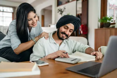 A family sitting together and planning their household budget