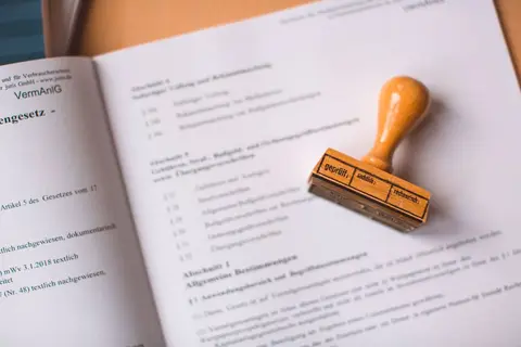 Official business documents with a stamp, representing a regulatory accounting standard