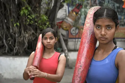 Members of an Indian community sports club gathered on a court
