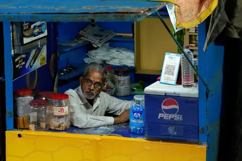Customers at a familiar neighbourhood shop, representing the goodwill a business builds over time