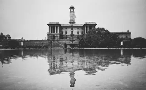 The Indian Parliament building in New Delhi representing government policy decisions
