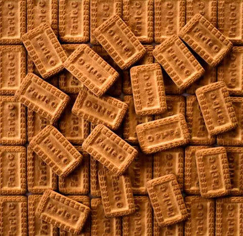 A ₹5 Parle-G biscuit packet, iconic yellow packaging.