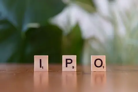 An IPO listing board at an Indian stock exchange showing a company's debut on the market.