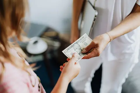 Indian family receiving a remittance payment at home