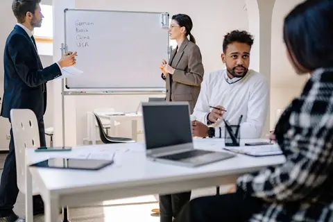 A diverse group of people at a business meeting representing different stakeholder perspectives.