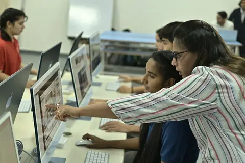 Students in a digital literacy class in India, showing CSR-funded education in action.