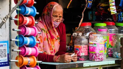 A woman entrepreneur working in her small food production business in India