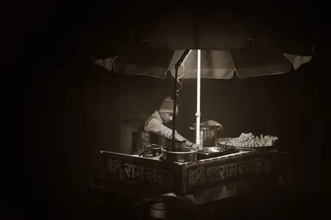 A small street food stall run by a single person in India