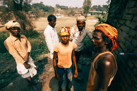 Census survey workers visiting a village household in India.