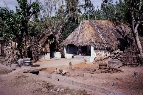 A black and white photograph of a rural Indian village scene from around the 1940s