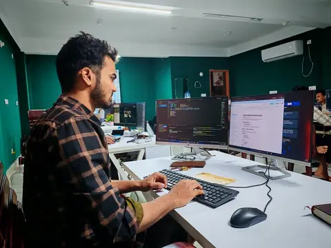 Indian software engineers working in an IT office, representing India's rise as a global technology services hub after globalisation