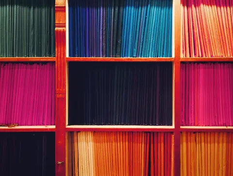 Wooden display shelves inside an Indian retail shop, representing a depreciating fixed asset.