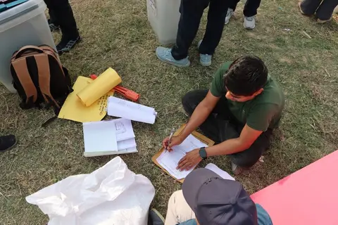 Indian NGO registration and compliance documents on a desk
