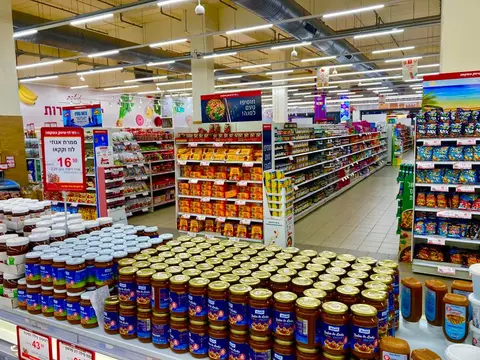 Overloaded supermarket shelves with excess inventory