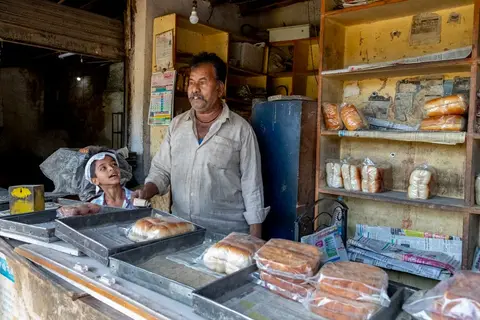 A family-run stationery shop counter in Kerala, representing a business with loyal customers and goodwill.